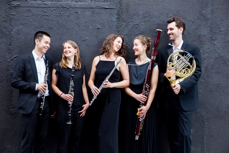 Group photo in front of wall